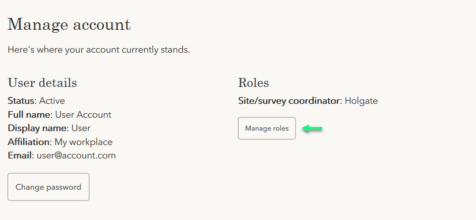 A green arrow indicates the location of the manage roles link.